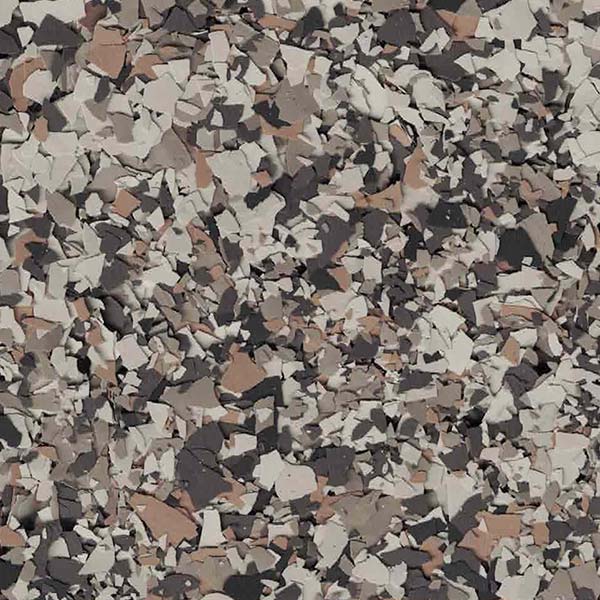 This image displays an abstract pattern composed of various fragmented shapes in a palette of muted brown, black, white, and gray tones.